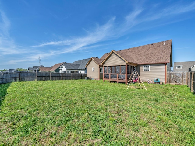1084 Harrison Way, Clarksville, TN 37042 - back of house featuring a fenced backyard, a sunroom, a yard, and a residential view