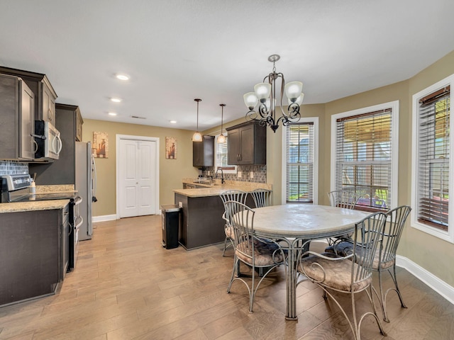 1084 Harrison Way, Clarksville, TN 37042 - dining area with recessed lighting, light wood-style floors, a healthy amount of sunlight, and baseboards