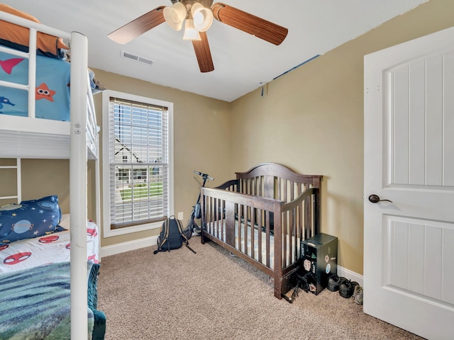 1084 Harrison Way, Clarksville, TN 37042 - carpeted bedroom featuring visible vents, a crib, baseboards, and ceiling fan