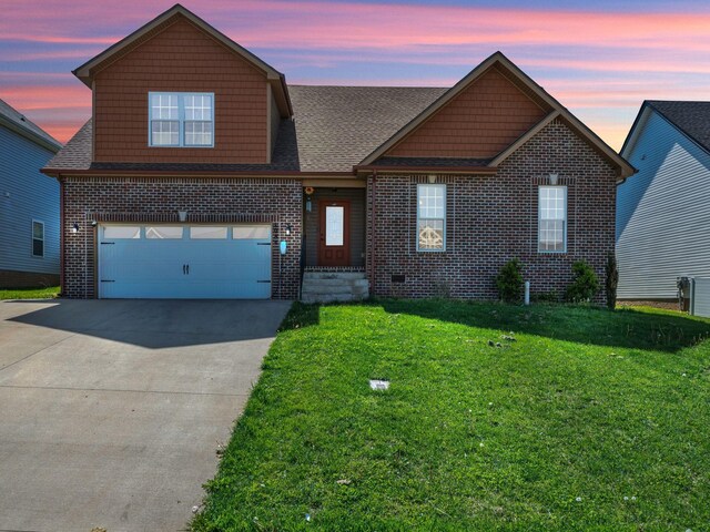 1084 Harrison Way, Clarksville, TN 37042 - traditional-style house featuring an attached garage, driveway, brick siding, and a yard