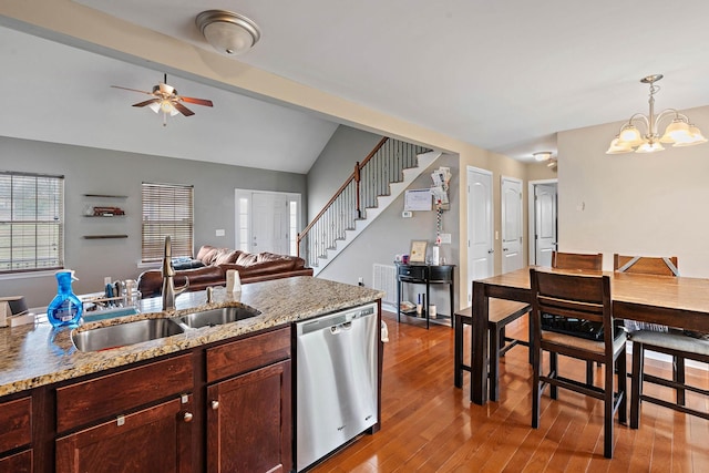 756 Maylene Dr, Madison, TN 37115 - kitchen with a sink, open floor plan, wood finished floors, ceiling fan with notable chandelier, and stainless steel dishwasher
