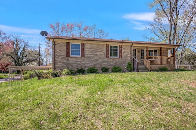 ranch-style home with a porch, brick siding, and a front lawn