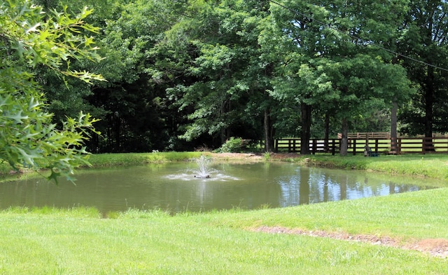view of water feature with fence