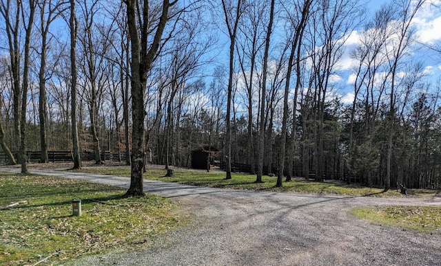 view of street featuring a forest view