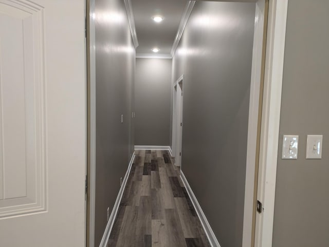 hallway with recessed lighting, baseboards, ornamental molding, and dark wood finished floors