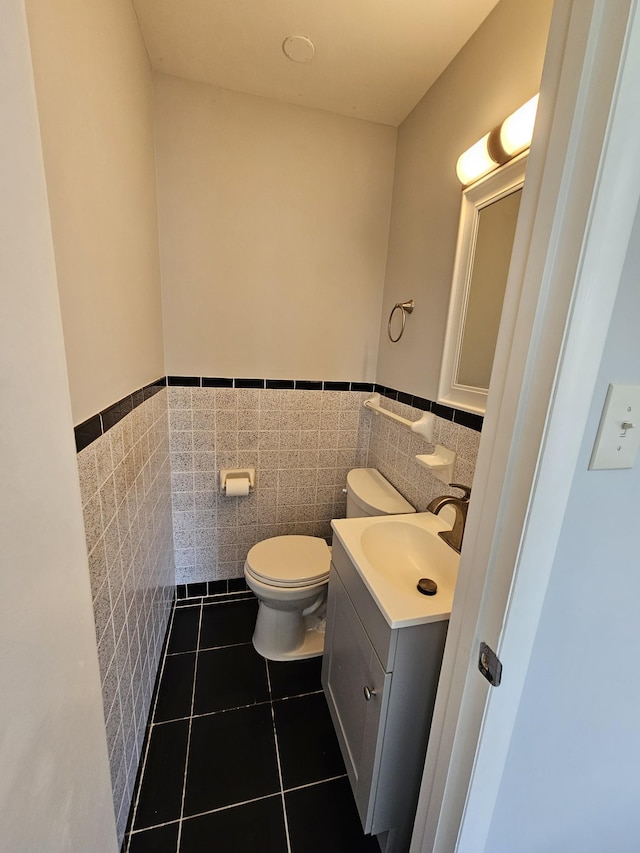 5006 Brookside Dr, Columbia, TN 38401 - half bath with toilet, tile walls, wainscoting, tile patterned flooring, and vanity