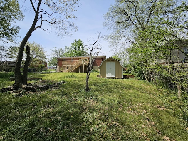 5006 Brookside Dr, Columbia, TN 38401 - view of yard featuring stairway, fence, a shed, a wooden deck, and an outdoor structure