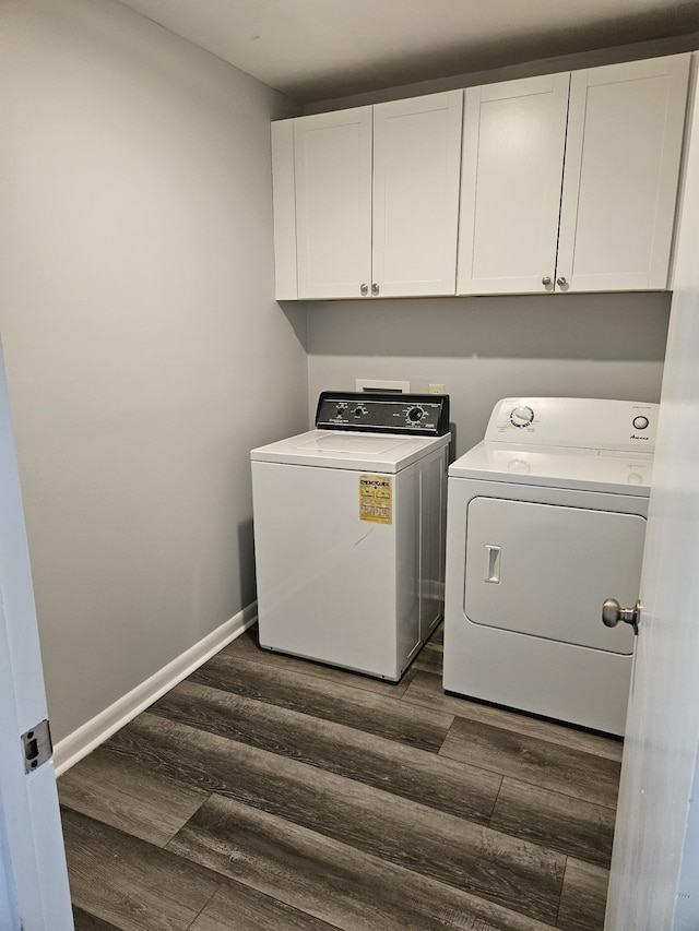 5006 Brookside Dr, Columbia, TN 38401 - laundry area featuring washing machine and dryer, dark wood-style flooring, cabinet space, and baseboards
