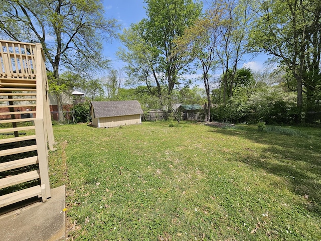 5006 Brookside Dr, Columbia, TN 38401 - view of yard featuring stairs, fence, a shed, an outdoor structure, and a deck