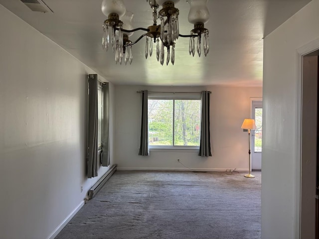 empty room featuring visible vents, baseboard heating, a chandelier, carpet flooring, and baseboards