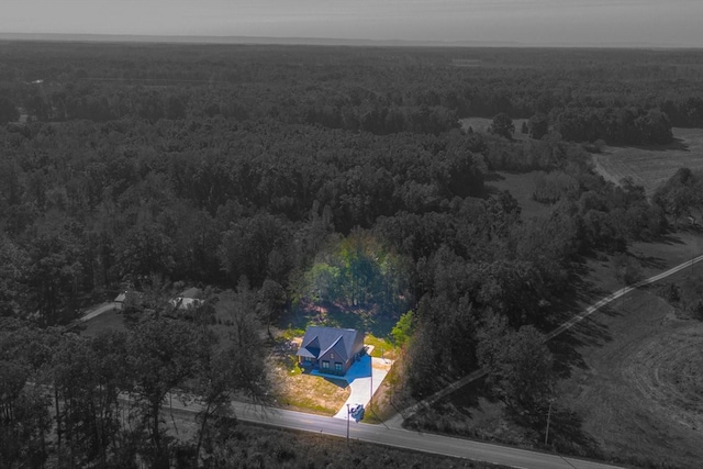 drone / aerial view with a view of trees