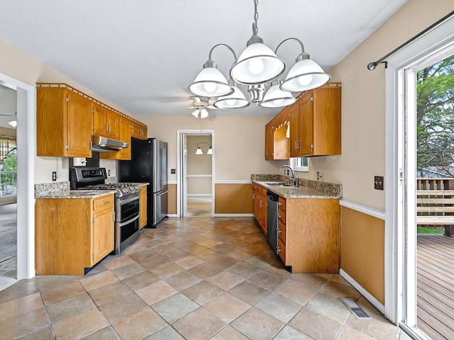 kitchen featuring visible vents, an inviting chandelier, a sink, appliances with stainless steel finishes, and under cabinet range hood