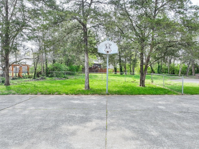 view of patio / terrace with community basketball court and fence