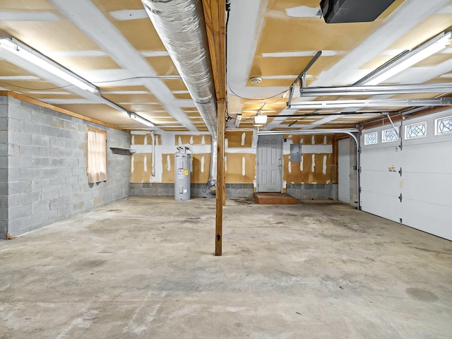 garage with a garage door opener, electric panel, and water heater