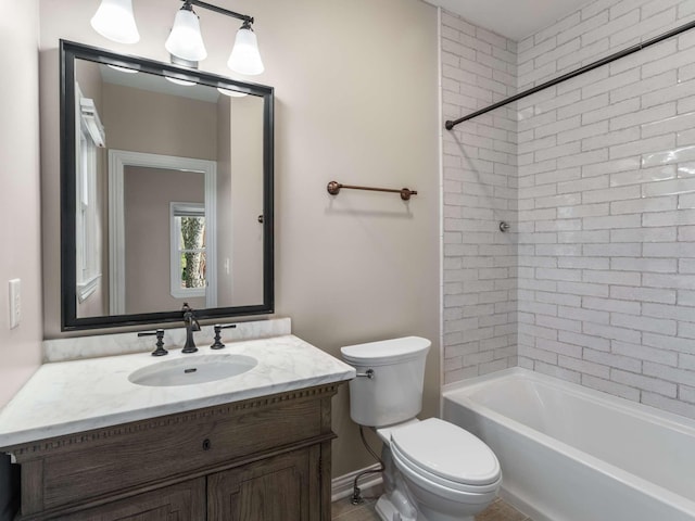 bathroom with toilet, shower / bathing tub combination, and vanity