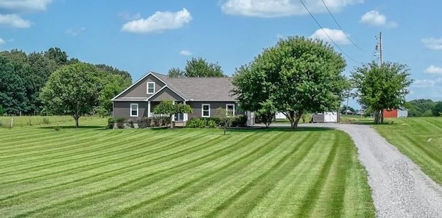 view of front of home featuring driveway and a front yard