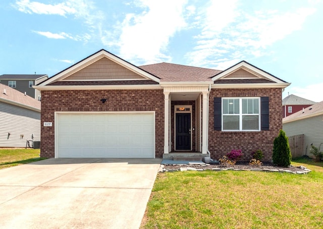 627 Prominence Rd, Columbia, TN 38401 - view of front of home with brick siding, a front yard, driveway, and an attached garage