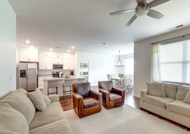 627 Prominence Rd, Columbia, TN 38401 - living room featuring wood finished floors, recessed lighting, a chandelier, ceiling fan, and baseboards