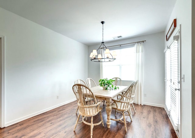 627 Prominence Rd, Columbia, TN 38401 - dining space featuring a chandelier, wood finished floors, and baseboards