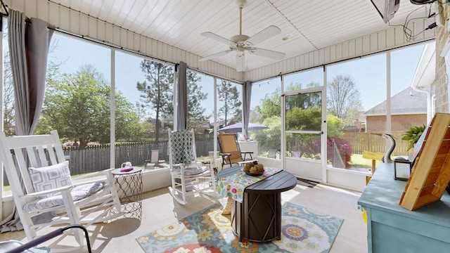 sunroom / solarium with a wealth of natural light and ceiling fan