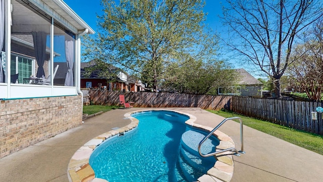 view of pool featuring a fenced backyard, a sunroom, a patio, and a fenced in pool