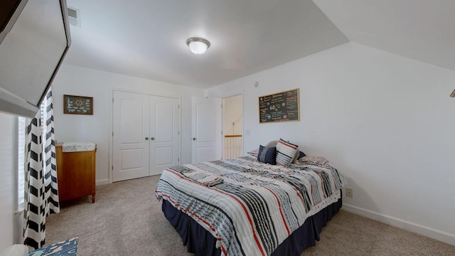 bedroom featuring baseboards, carpet floors, and a closet