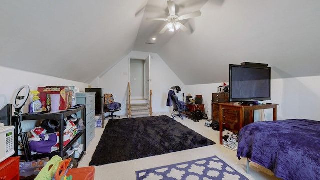 bedroom with vaulted ceiling, carpet flooring, and a ceiling fan