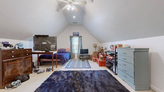 bedroom featuring ceiling fan, vaulted ceiling, visible vents, and carpet floors