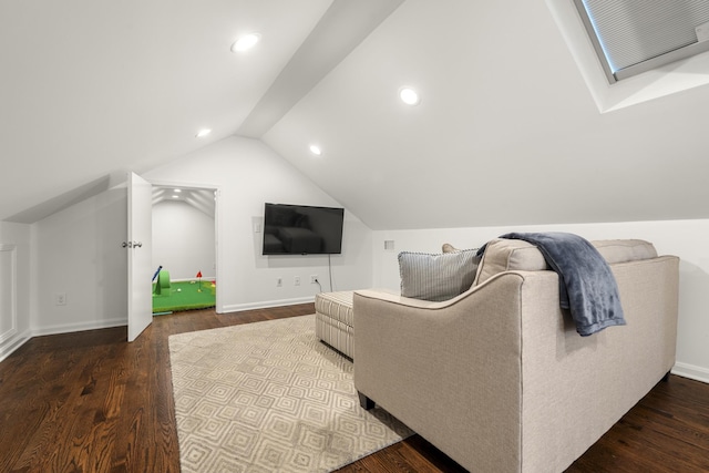 living area with lofted ceiling with skylight, recessed lighting, baseboards, and wood finished floors