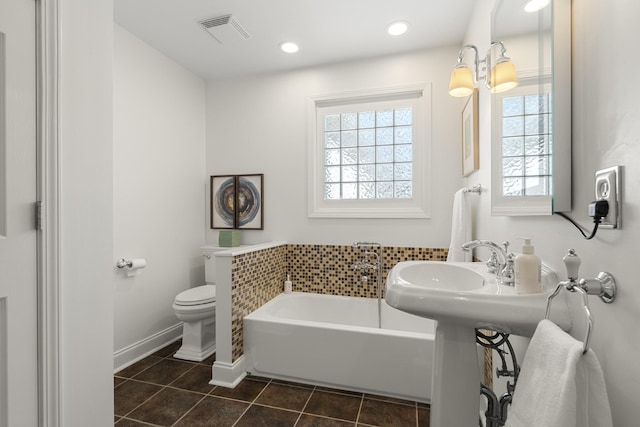bathroom with a bath, visible vents, recessed lighting, toilet, and tile patterned floors