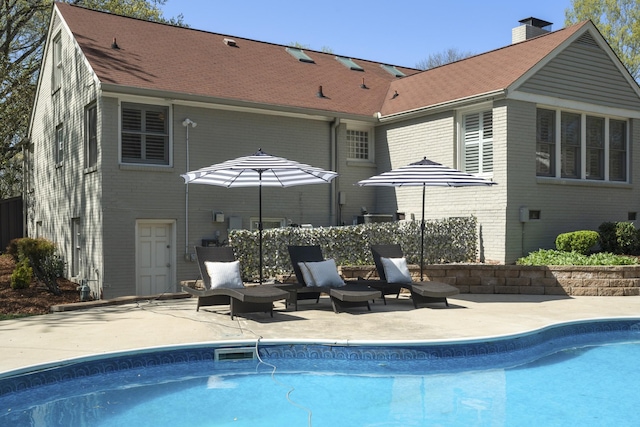 pool featuring a patio area