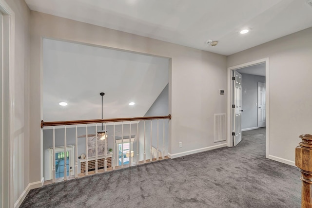 hall featuring visible vents, baseboards, recessed lighting, and carpet
