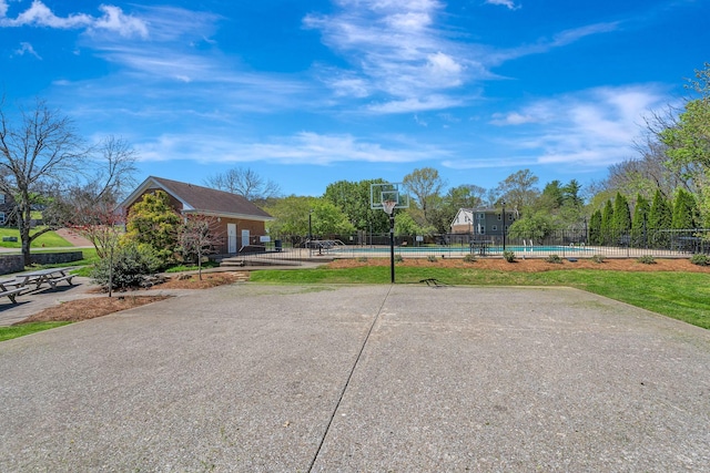 surrounding community featuring a pool, a patio, and fence