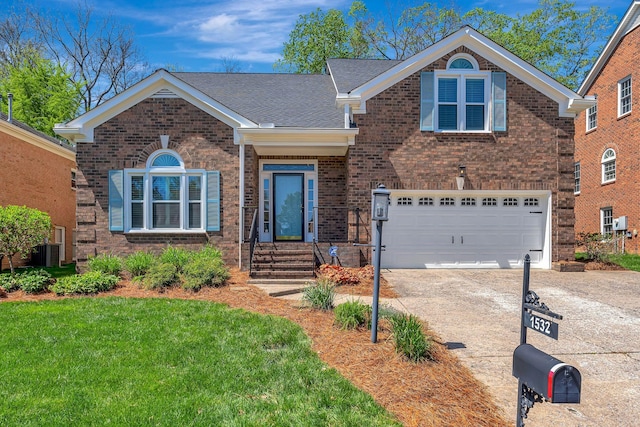 view of front of home featuring concrete driveway, a front yard, brick siding, central AC, and a garage