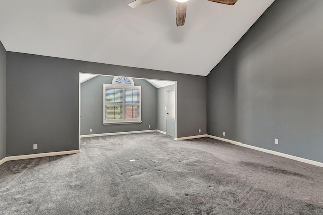 spare room featuring carpet flooring, baseboards, a ceiling fan, and lofted ceiling