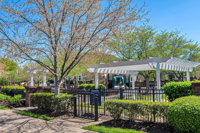 view of community with a pergola, fence, and playground community