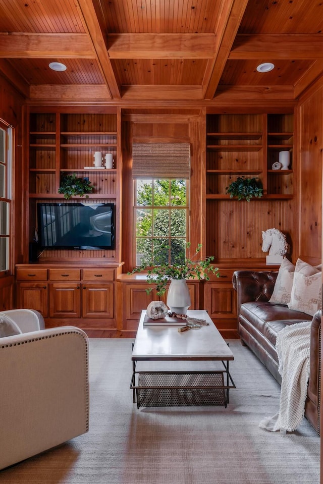 living area featuring wooden walls, wood ceiling, and coffered ceiling