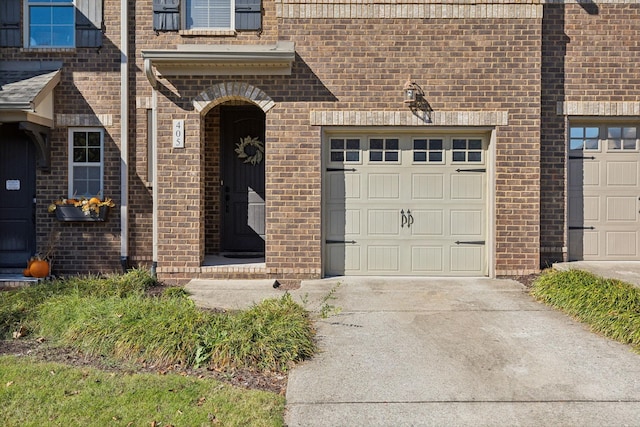 405 Waterbrook Dr, Mount Juliet, TN 37122 - property entrance featuring a garage, brick siding, and driveway