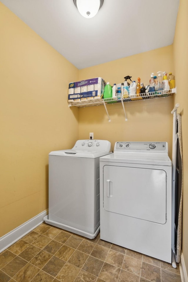 405 Waterbrook Dr, Mount Juliet, TN 37122 - clothes washing area featuring stone finish flooring, washer and clothes dryer, laundry area, and baseboards