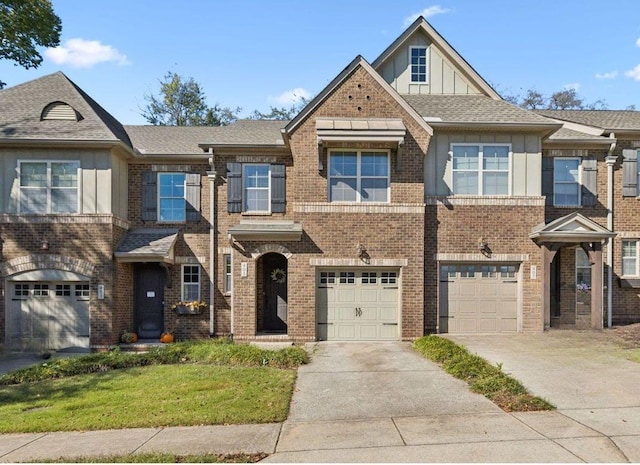 405 Waterbrook Dr, Mount Juliet, TN 37122 - townhome / multi-family property with brick siding, an attached garage, board and batten siding, and driveway