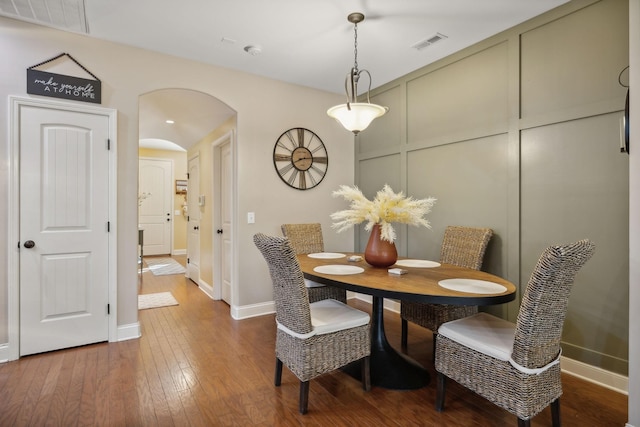405 Waterbrook Dr, Mount Juliet, TN 37122 - dining space featuring visible vents, baseboards, arched walkways, and wood finished floors