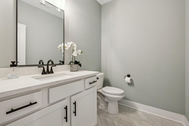1060 Veridian Dr Unit 23A, Clarksville, TN 37043 - bathroom featuring vanity, baseboards, toilet, visible vents, and marble finish floor