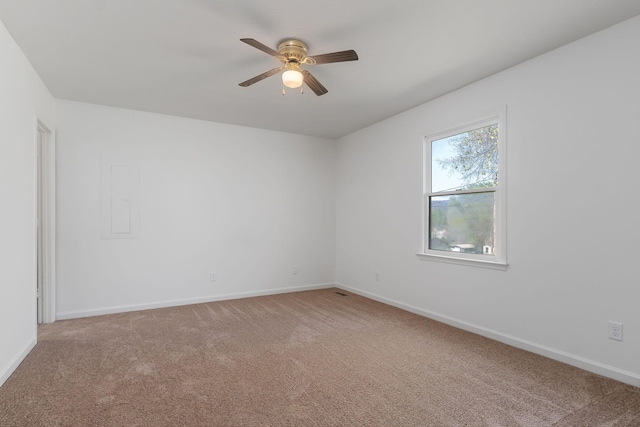 unfurnished room with ceiling fan, baseboards, and carpet floors