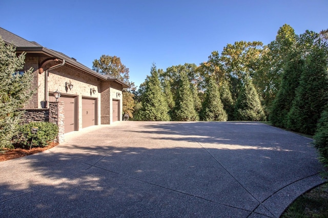 1824 Stryker Pl, Brentwood, TN 37027 - view of property exterior with an attached garage, driveway, and stone siding
