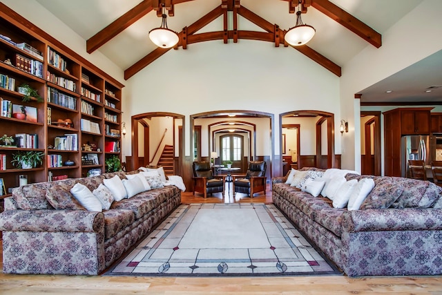 1824 Stryker Pl, Brentwood, TN 37027 - living room with arched walkways, beamed ceiling, high vaulted ceiling, and light wood finished floors