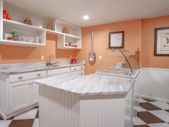 1824 Stryker Pl, Brentwood, TN 37027 - interior space featuring a wainscoted wall, white cabinets, and open shelves