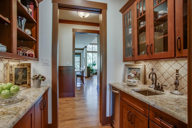 1824 Stryker Pl, Brentwood, TN 37027 - bar with stainless steel dishwasher, a wainscoted wall, tasteful backsplash, a sink, and light wood finished floors