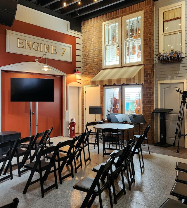 1824 Stryker Pl, Brentwood, TN 37027 - dining space with brick wall and a towering ceiling