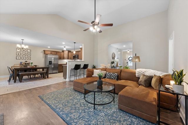 2229 Allen Griffey Rd, Clarksville, TN 37042 - living area with recessed lighting, high vaulted ceiling, light wood-style flooring, and ceiling fan with notable chandelier