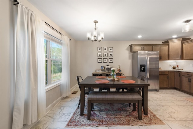 2229 Allen Griffey Rd, Clarksville, TN 37042 - dining space featuring baseboards, recessed lighting, a chandelier, and marble finish floor